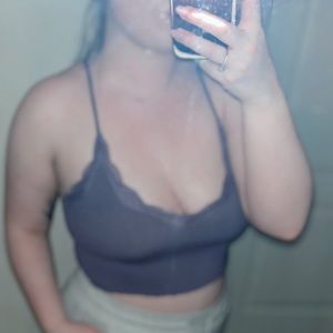 Cropped, ribbed, purple tank top with lace on the neck line.